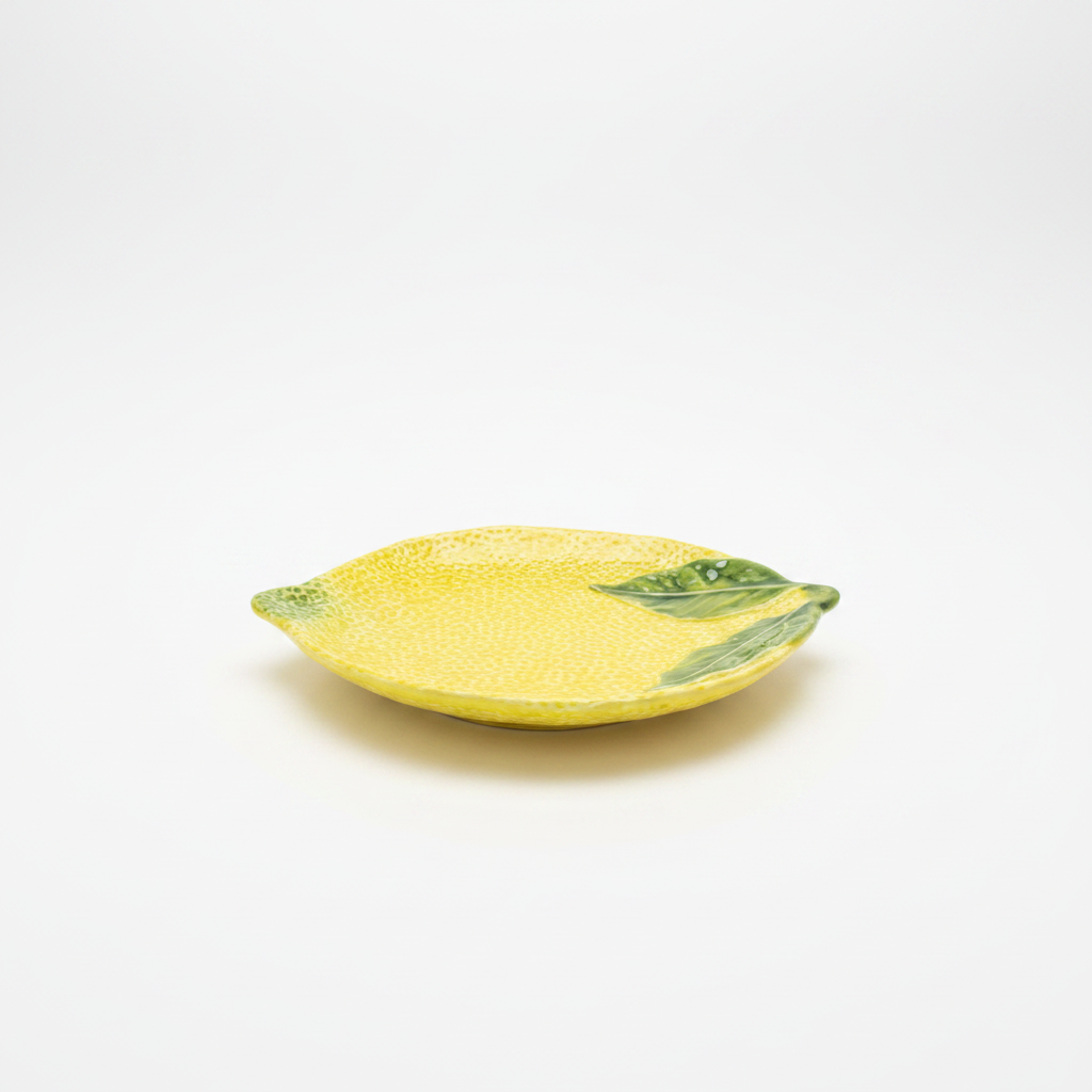 Ceramic lemon plate side view white background